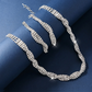 Set med halsband och örhängen med glittrande strass och klorformad kedja för kvinnor
